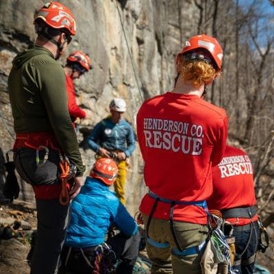 Henderson County rescue personnel listen to Karsten Delap's climber rescue instruction
